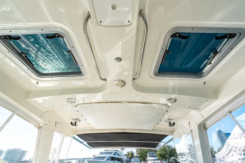 Slide: The Image of 2015 Boston Whaler 345 Conquest cabin ceiling with skylights and modern design. - 51