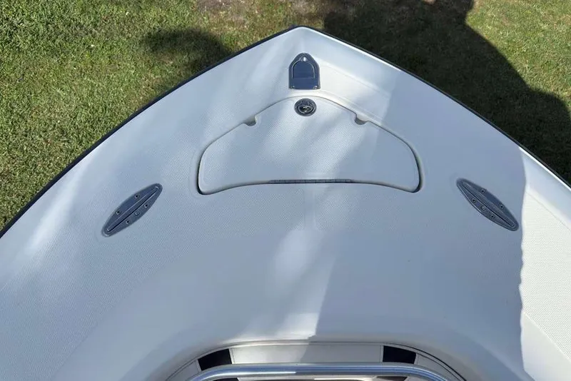 Slide: The Image of 2003 Hydra-Sports Vector 2400 CC boat deck, featuring sleek design and stainless steel fittings. - 15