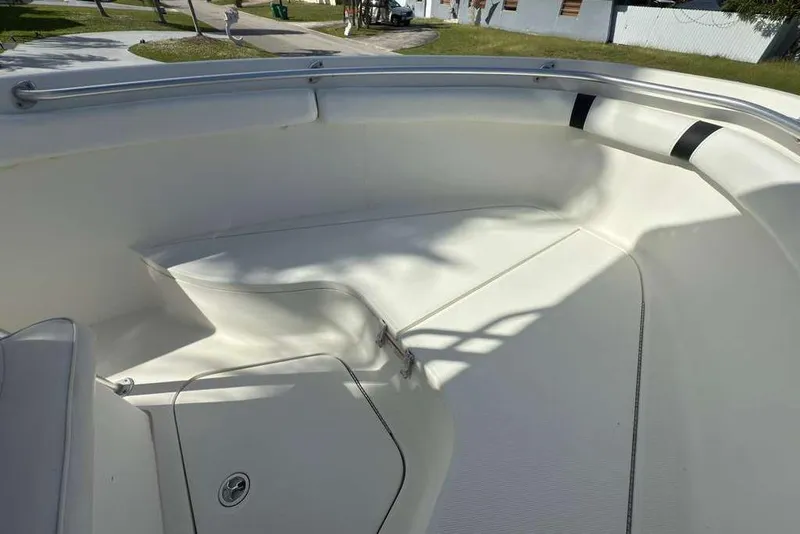 Slide: The Image of 2003 Hydra-Sports Vector 2400 CC boat interior with white seating and deck. - 17