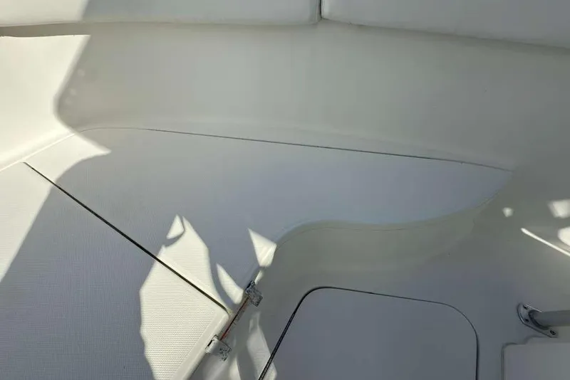 Slide: The Image of 2003 Hydra-Sports Vector 2400 CC interior seating area with white upholstery. - 18