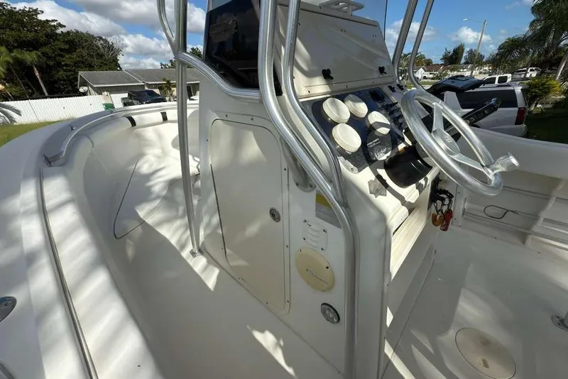 Slide: The Image of 2003 Hydra-Sports Vector 2400 CC boat console with steering wheel and gauges. - 21