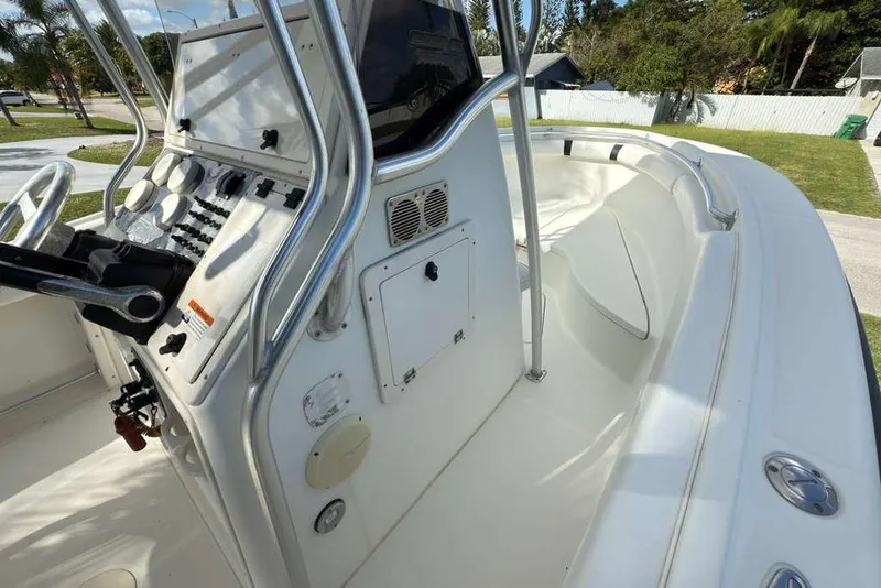 Slide: The Image of 2003 Hydra-Sports Vector 2400 CC boat cockpit with control panel and seating area. - 22
