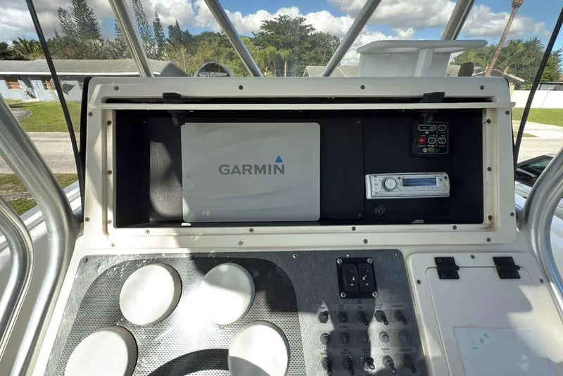 Slide: The Image of 2003 Hydra-Sports Vector 2400 CC dashboard with Garmin navigation system and control panel. - 25