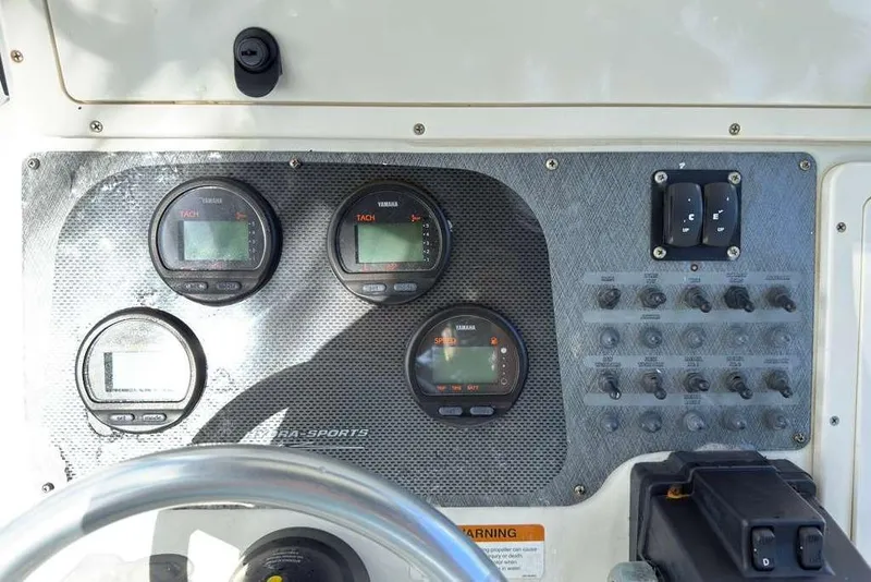 Slide: The Image of Dashboard of 2003 Hydra-Sports Vector 2400 CC boat with gauges and controls. - 29