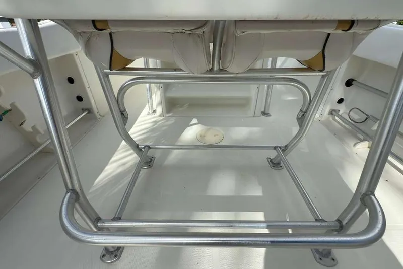 Slide: The Image of 2003 Hydra-Sports Vector 2400 CC boat interior with metal framework and seating. - 32