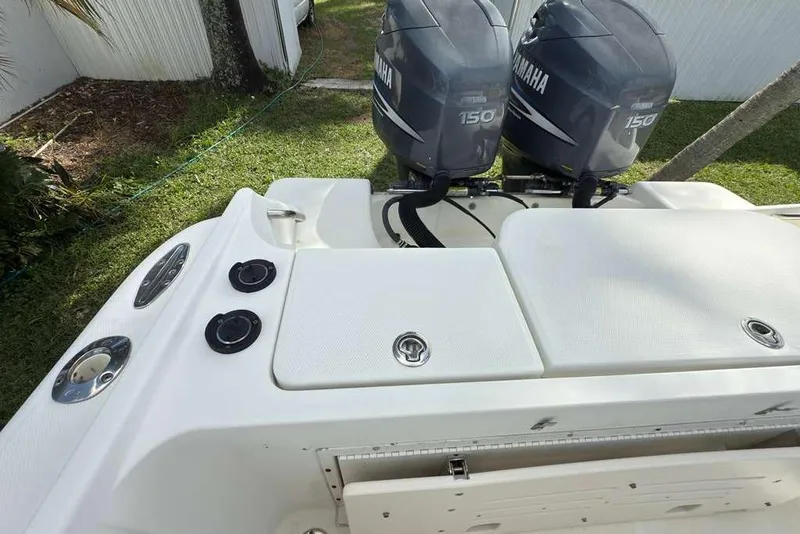 Slide: The Image of 2003 Hydra-Sports Vector 2400 CC boat with twin Yamaha 150 engines, docked on grass. - 39