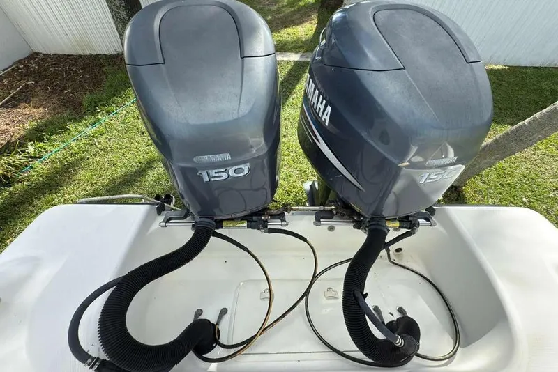 Slide: The Image of Twin Yamaha 150 outboard engines on a 2003 Hydra-Sports Vector 2400 CC boat. - 41