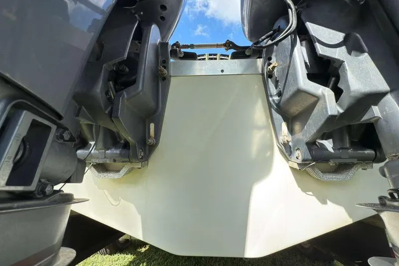 Slide: The Image of 2003 Hydra-Sports Vector 2400 CC boat engines, close-up view under sunny sky. - 44