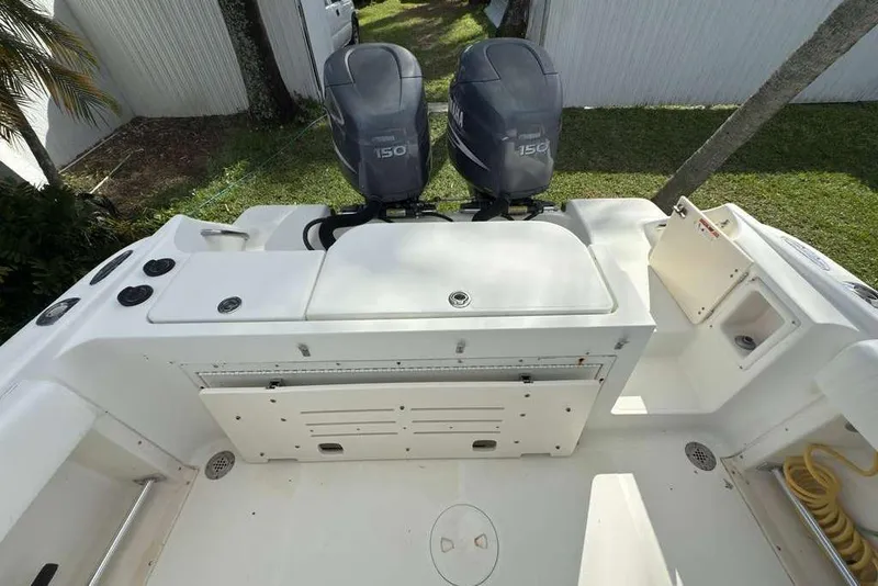 Slide: The Image of 2003 Hydra-Sports Vector 2400 CC boat with dual Yamaha 150 engines, white deck view. - 54