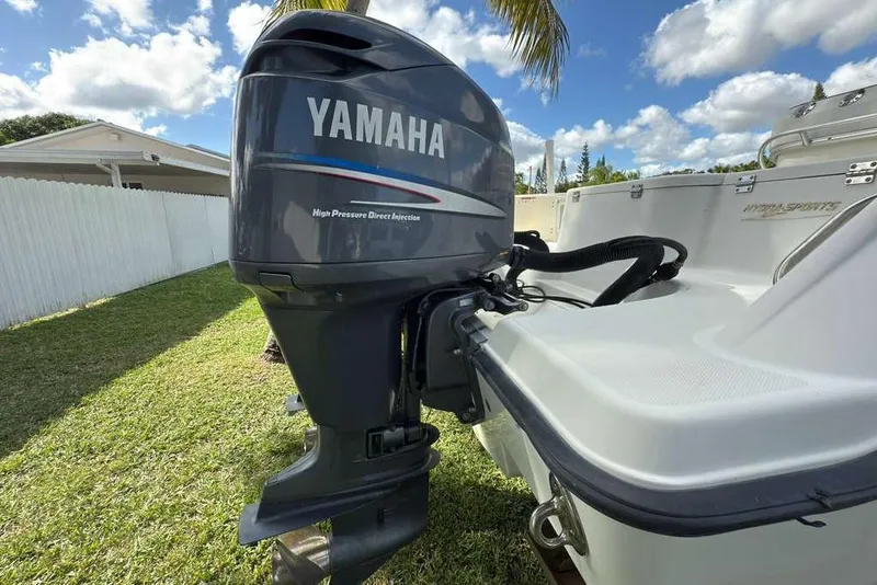 Slide: The Image of 2003 Hydra-Sports Vector 2400 CC with Yamaha outboard motor on grassy lawn. - 56