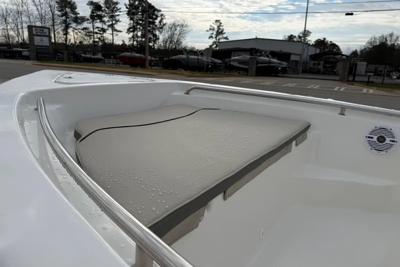 Slide: The Image of 2026 Key West 189 FS boat with cushioned seating and stainless steel railing. - 11