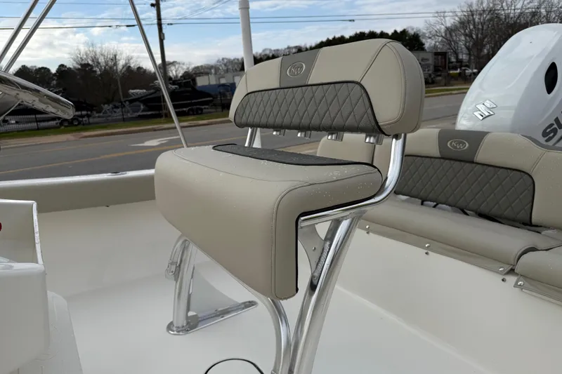 Slide: The Image of 2026 Key West 189 FS boat interior with cushioned seating and stainless steel frame. - 13