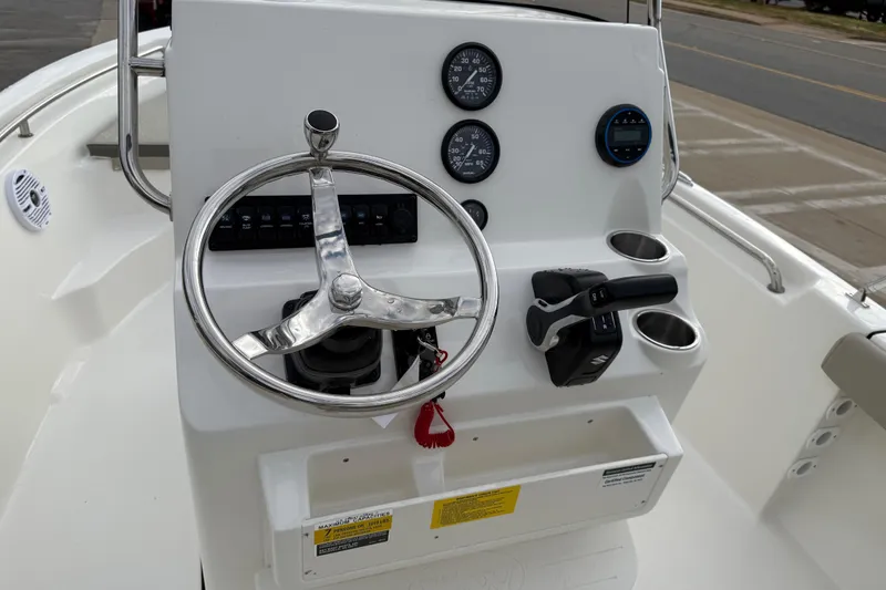 Slide: The Image of Steering console of 2026 Key West 189 FS boat with gauges and controls. - 15