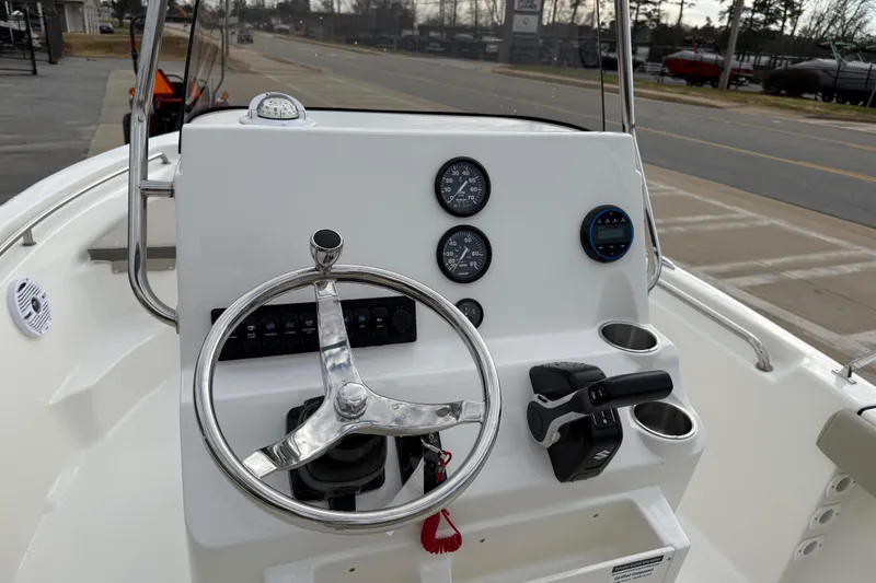 Slide: The Image of 2026 Key West 189 FS boat dashboard with steering wheel and gauges. - 16