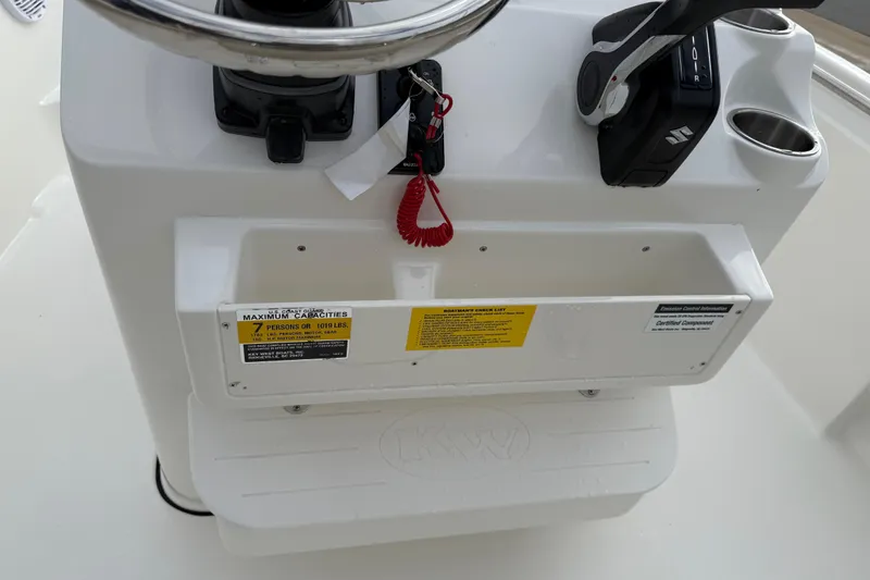Slide: The Image of Steering console of 2026 Key West 189 FS boat with capacity label. - 17