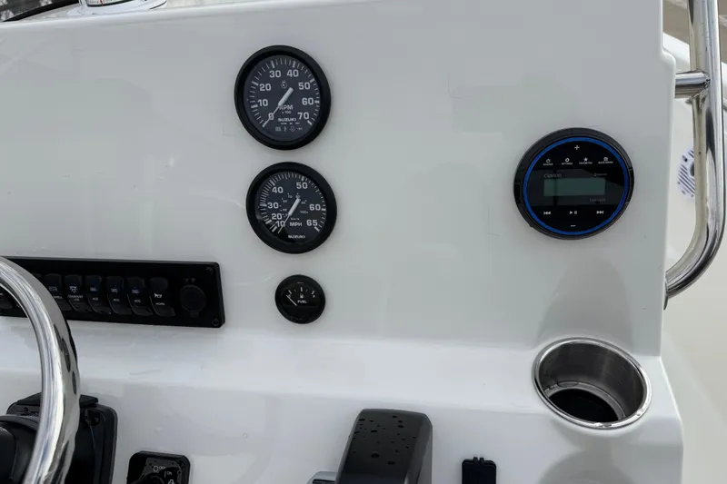 Slide: The Image of Dashboard of 2026 Key West 189 FS boat with gauges and controls. - 18