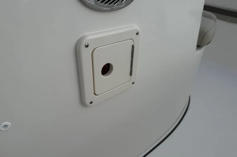 Slide: The Image of Key West 189 FS 2026 boat interior detail with access panel and speaker. - 19