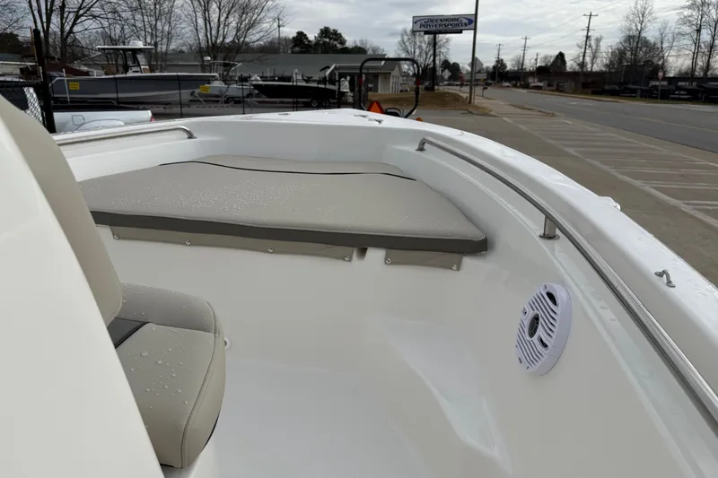 Slide: The Image of 2026 Key West 189 FS boat interior with cushioned seating and speaker. - 21