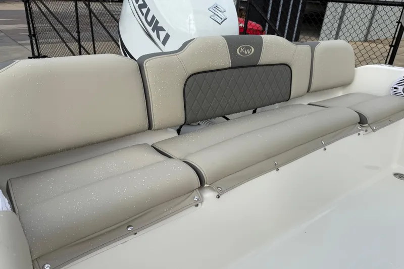 Slide: The Image of 2026 Key West 189 FS boat interior with beige cushioned seating. - 22