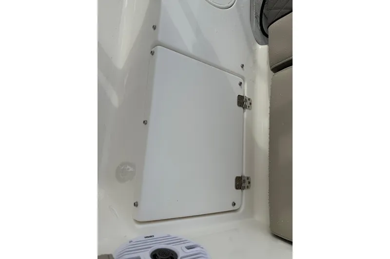 Slide: The Image of 2026 Key West 189 FS boat interior with storage compartment and speaker. - 25