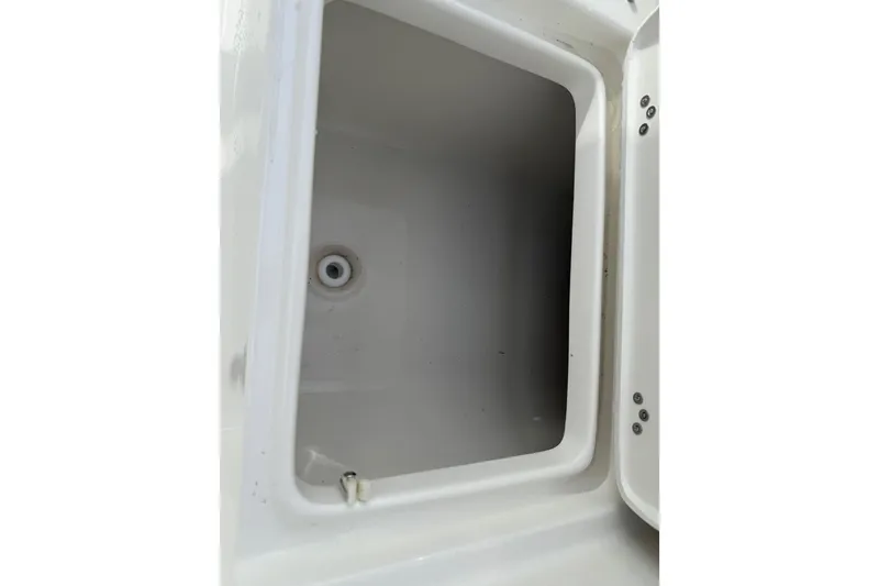 Slide: The Image of Open storage compartment on 2026 Key West 189 FS boat. - 26