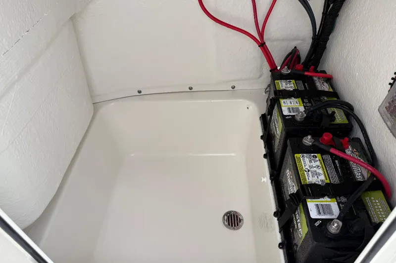 Slide: The Image of Battery compartment of 2026 Key West 189 FS boat with wiring. - 28