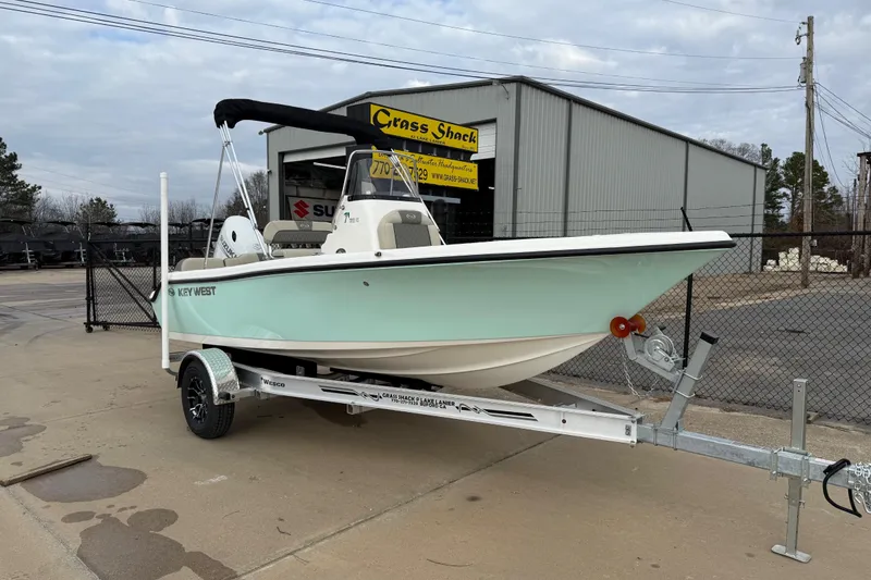 Slide: The Image of 2026 Key West 189 FS boat on trailer, parked outside dealership. - 6