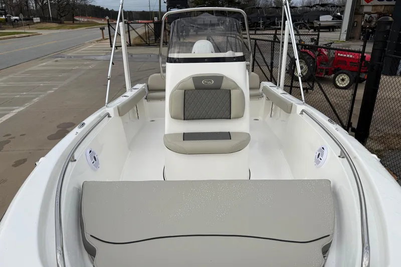 Slide: The Image of 2026 Key West 189 FS boat interior with cushioned seating and console. - 7