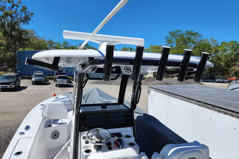 Slide: The Image of 2023 Sportsman Heritage 261 Center Console boat with sleek design and advanced controls. - 5