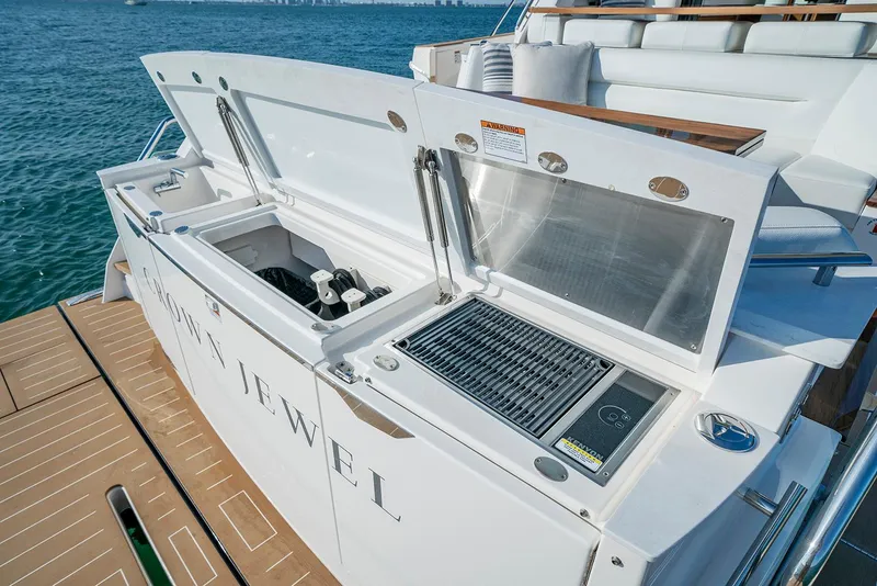 Slide: The Image of Manufacturer Provided Image: 2026 Tiara Yachts EX 60 outdoor kitchen with grill and sink on deck. - 12