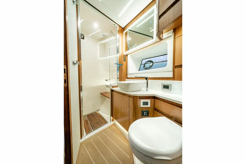 Slide: The Image of Manufacturer Provided Image: Luxurious bathroom in 2026 Tiara Yachts EX 60, featuring modern fixtures and elegant wood accents. - 22