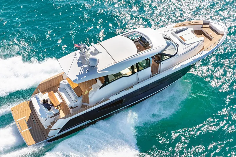 Slide: The Image of Manufacturer Provided Image: 2026 Tiara Yachts EX 60 cruising on vibrant blue ocean waters. - 3
