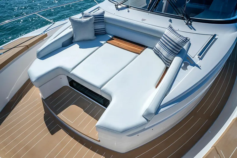 Slide: The Image of Manufacturer Provided Image: 2026 Tiara Yachts EX 60 deck with luxurious seating and striped cushions. - 5