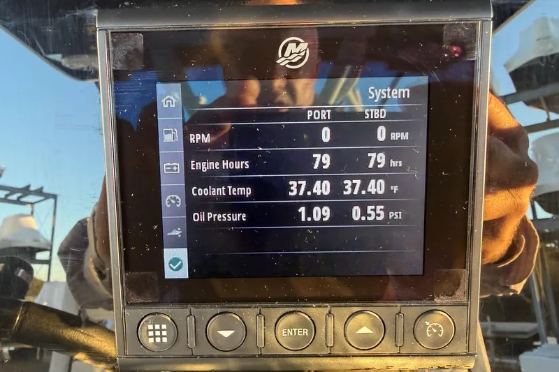 Slide: The Image of Display screen of 2023 Blackfin 272 CC showing engine metrics and system status. - 14