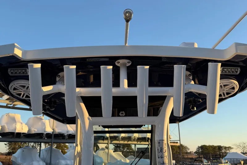 Slide: The Image of 2023 Blackfin 272 CC boat with rod holders and speakers, viewed from below. - 17