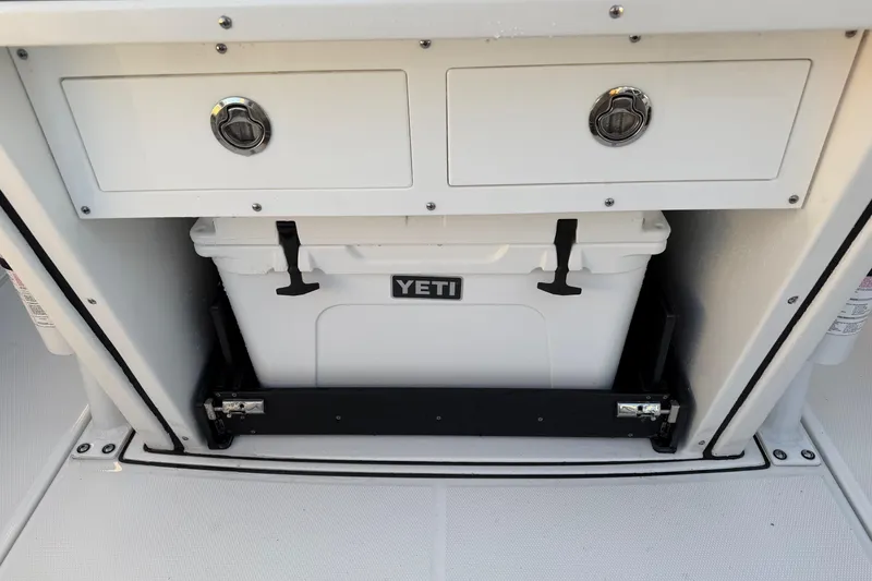 Slide: The Image of 2023 Blackfin 272 CC boat storage with Yeti cooler and dual drawers. - 19