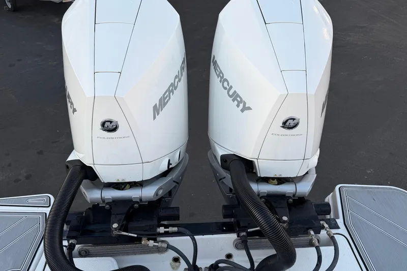 Slide: The Image of Twin Mercury outboard engines on a 2023 Blackfin 272 CC boat. - 28
