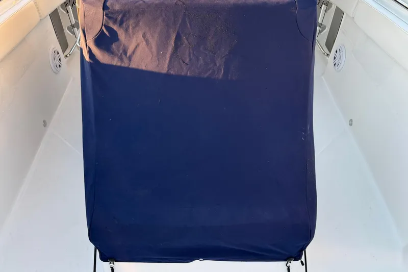 Slide: The Image of 2023 Blackfin 272 CC boat seat with navy cover in bright sunlight. - 32