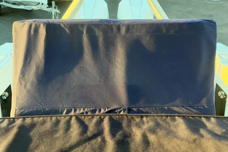 Slide: The Image of Blackfin 272 CC 2023 boat seat with protective cover in sunlight. - 35