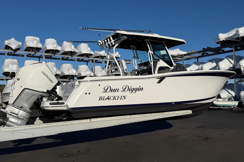 Slide: The Image of 2023 Blackfin 272 CC boat with Mercury engine on a trailer. - 4