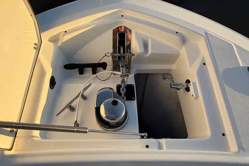 Slide: The Image of 2023 Blackfin 272 CC boat anchor compartment with winch and storage. - 5