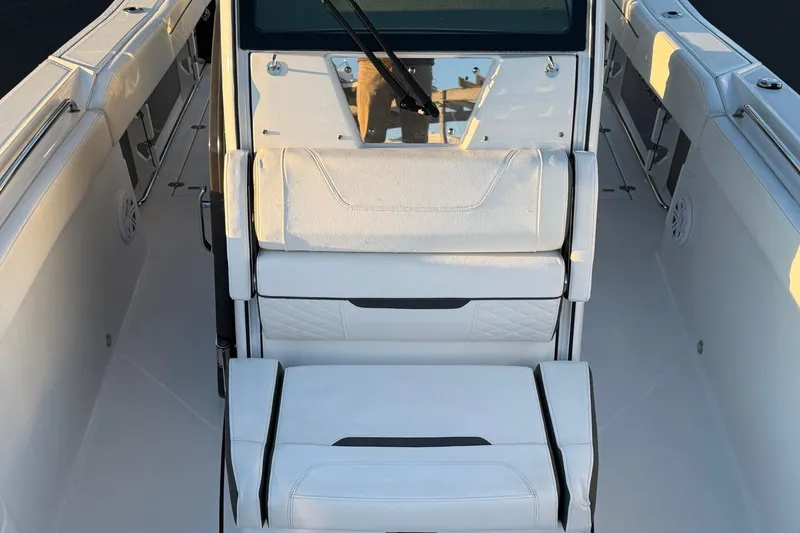 Slide: The Image of 2023 Blackfin 272 CC boat interior with white seating and sleek design. - 8
