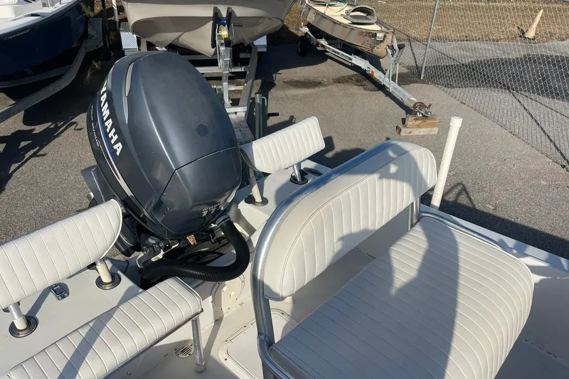Slide: The Image of 1974 Mako 1701 Inshore boat with Yamaha outboard motor and white seating. - 5