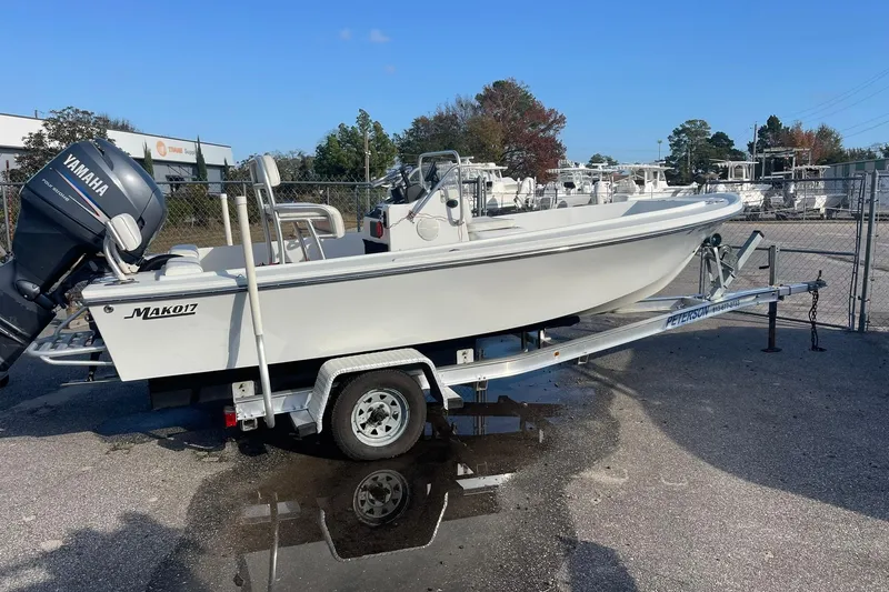 Slide: The Image of 1974 Mako 1701 Inshore boat on trailer with Yamaha outboard motor. - 7