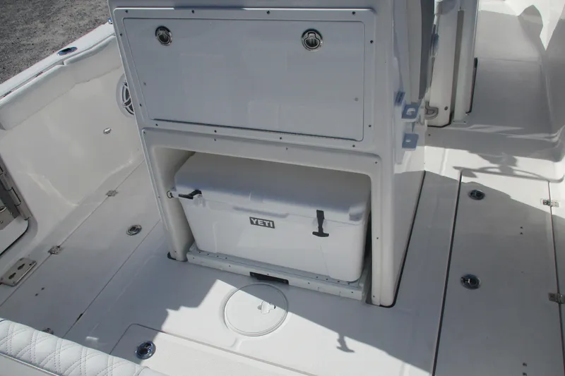 Slide: The Image of 2026 Sea Fox 288 Commander boat interior with Yeti cooler storage. - 13