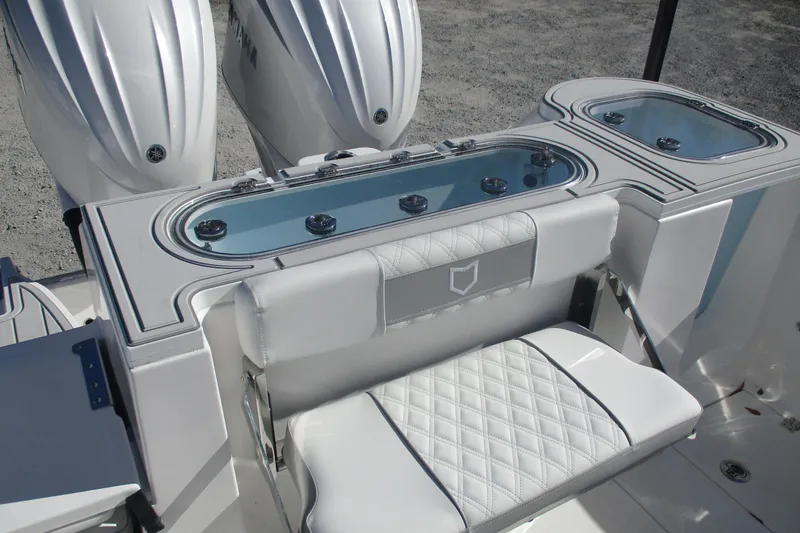 Slide: The Image of 2026 Sea Fox 288 Commander boat with dual engines and cushioned seating. - 14