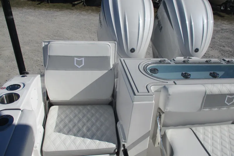Slide: The Image of 2026 Sea Fox 288 Commander boat interior with dual engines and cushioned seating. - 16