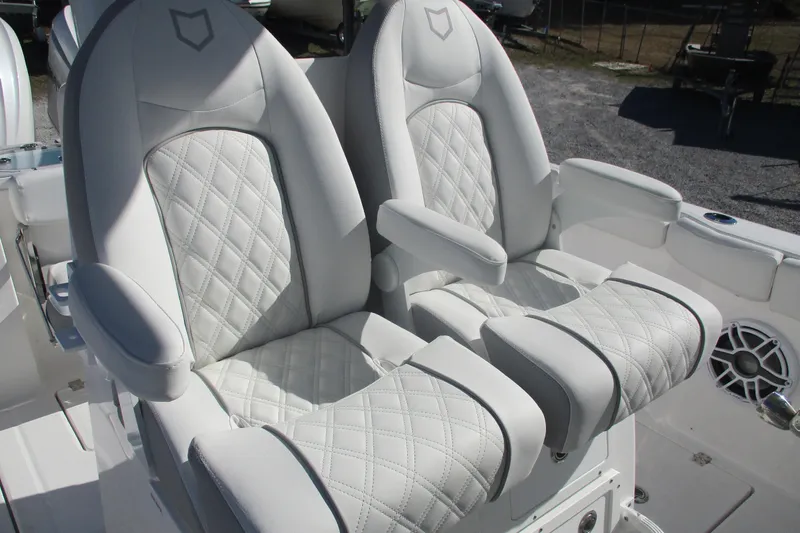 Slide: The Image of Luxurious seating on 2026 Sea Fox 288 Commander boat with quilted white upholstery. - 17