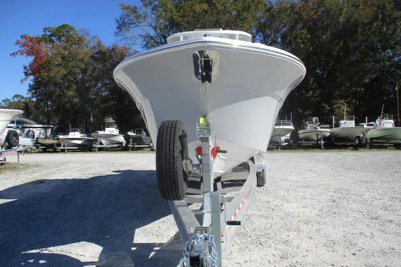 Slide: The Image of 2026 Sea Fox 288 Commander boat on trailer, parked outdoors in a boatyard. - 2