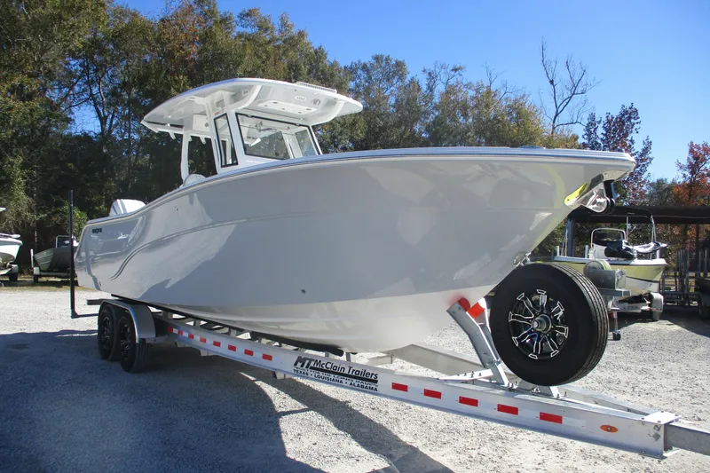 Slide: The Image of 2026 Sea Fox 288 Commander boat on trailer, parked outdoors. - 3